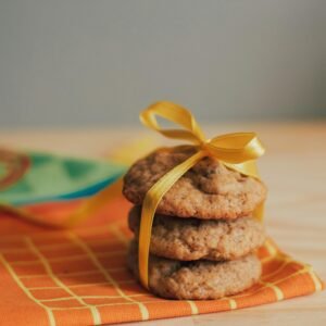 A delicious stack of homemade cookies tied with a yellow ribbon, perfect for gift-giving.